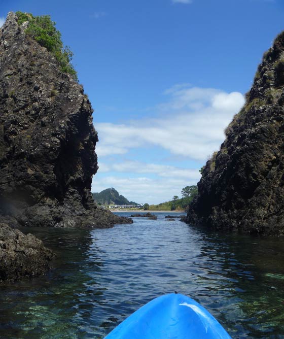 Kayak passing rock features at Taiharuru in Norhtland