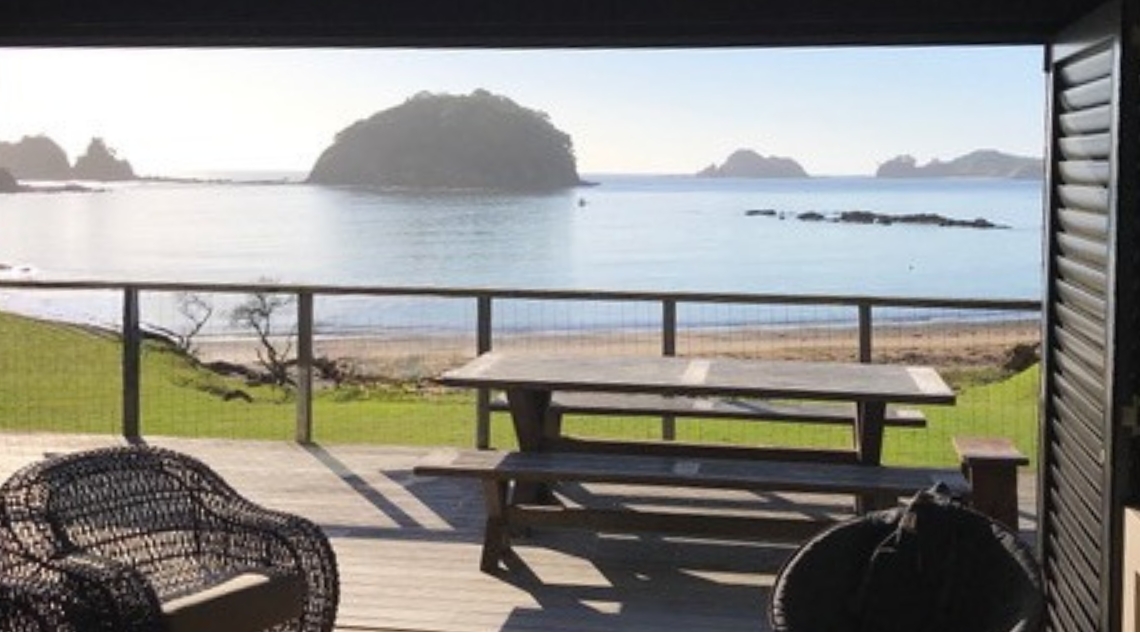 the-beach-house-living-are-a-w-fire-place-whananaki-1